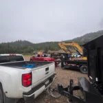 TNT Kelowna dump truck hauling aggregates on a construction site in Kelowna, BC