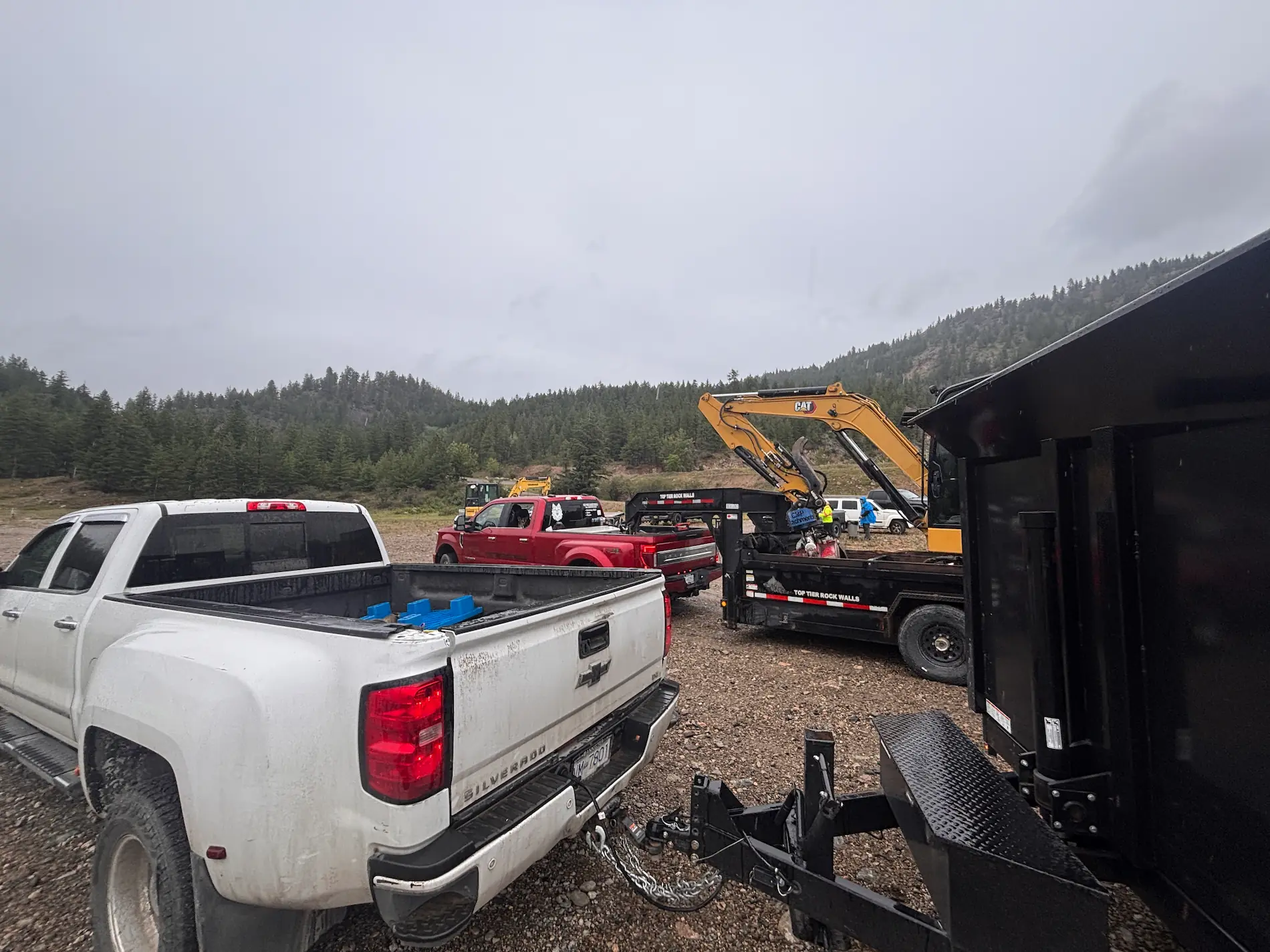 TNT Kelowna dump truck hauling aggregates on a construction site in Kelowna, BC